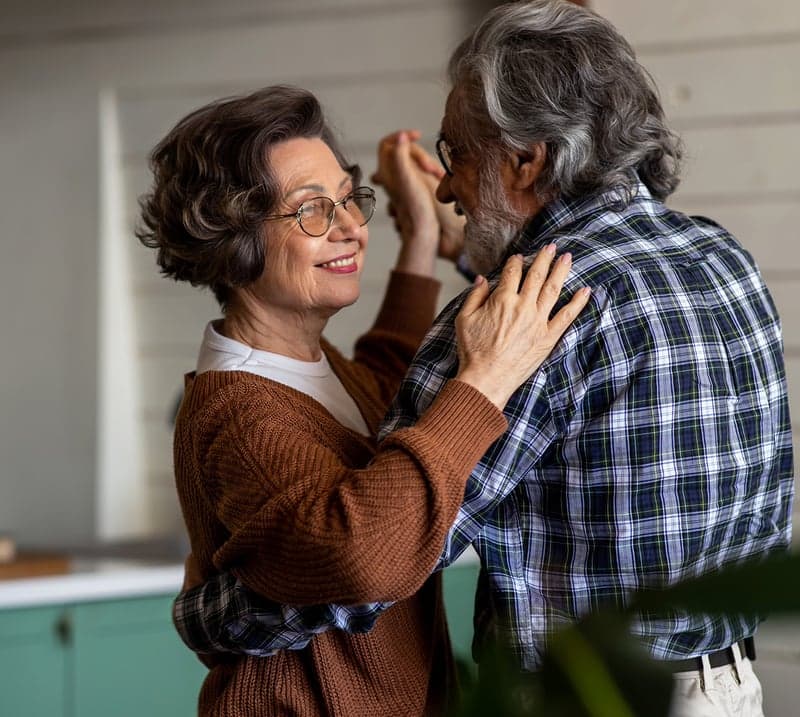 older man and woman dance