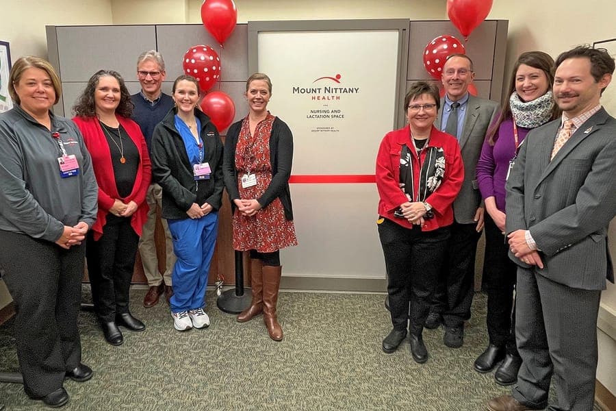 Members of the Women and Children's Unit standby for a ribbon cutting at the Schlow library lactation space
