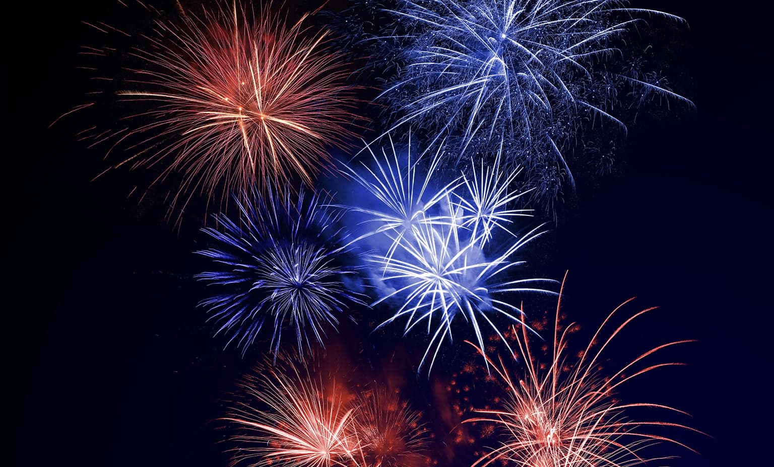 Night sky full of red and blue fireworks