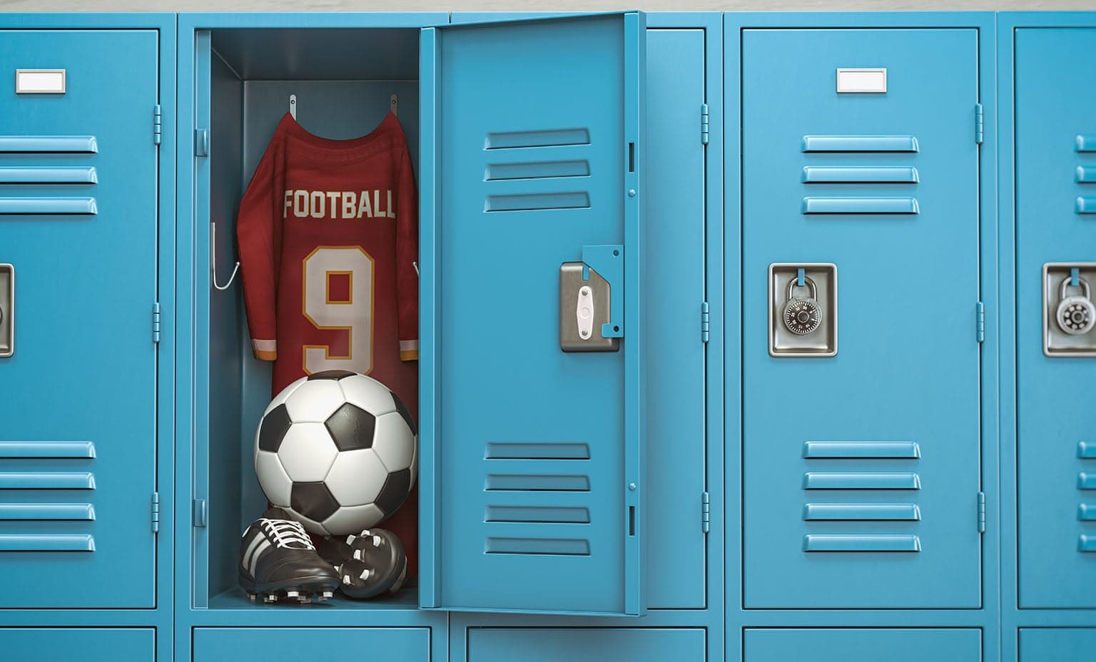 Inside of a blue school locker with a football jersey, soccer ball, and cleats