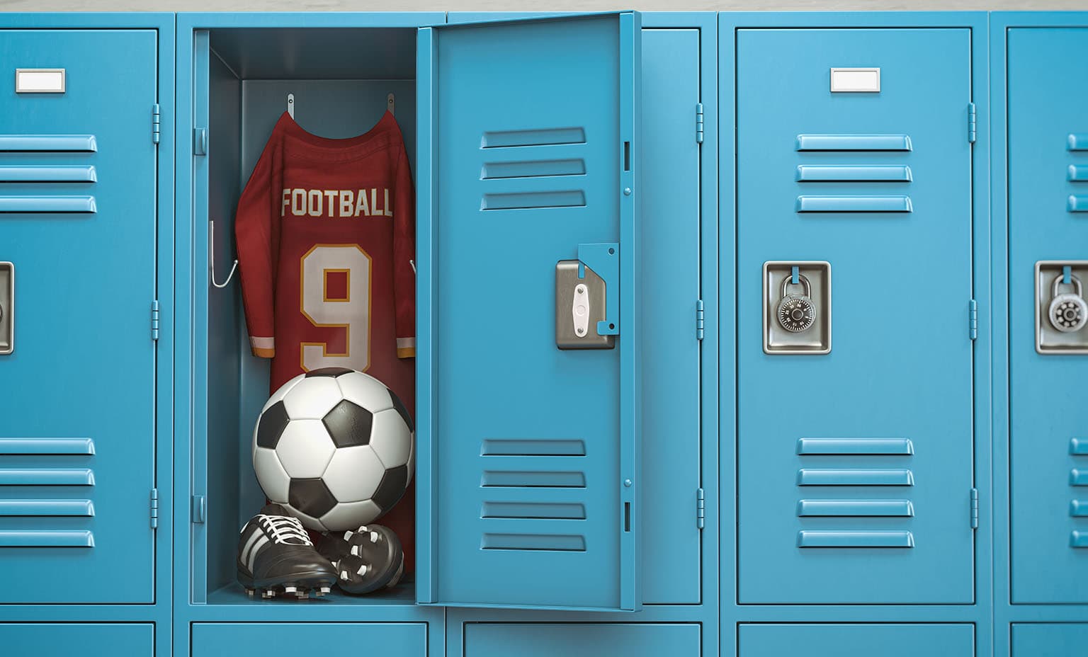 Inside of a blue school locker with a football jersey, soccer ball, and cleats