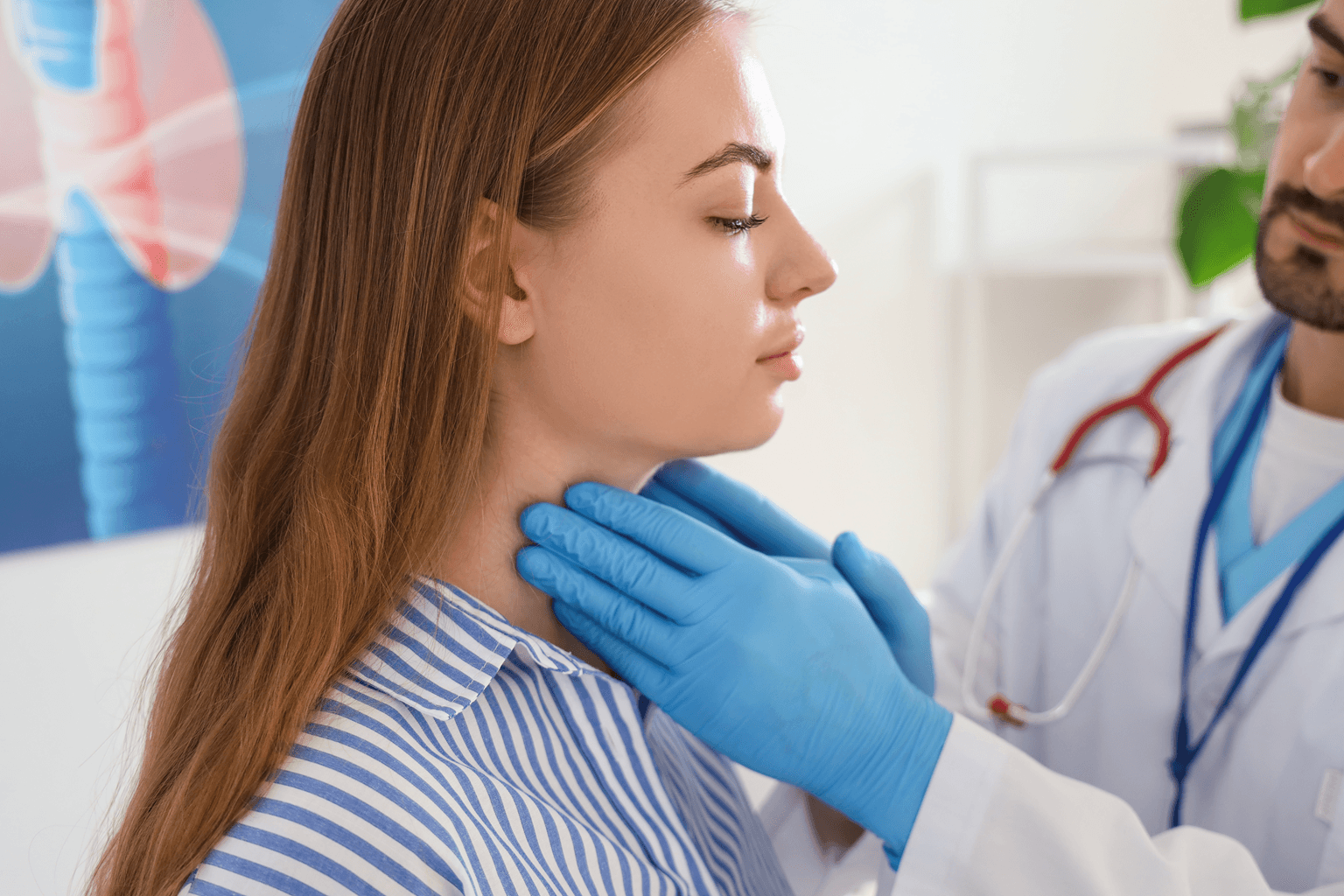 Male endocrinologist examining woman's thyroid gland in clinic,